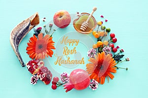 Religion image of Rosh hashanah jewish New Year holiday concept. Traditional symbols over wooden mint blue pastel background