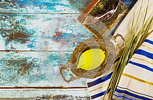 Religion jewish celebration holiday Sukkot. Etrog, lulav, hadas arava kippah and shofar tallit praying book photo