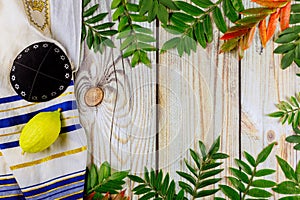 Religion jewish celebration holiday Sukkot. Etrog, lulav, hadas arava kippah and shofar tallit praying book photo