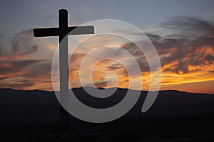 Religion theme, catholic cross and sunset