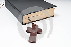 Religion or theology concept. Bible book and crucifix