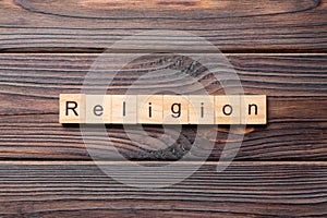 Religion word written on wood block. Religion text on cement table for your desing, concept