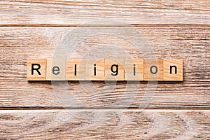 Religion word written on wood block. Religion text on wooden table for your desing, concept