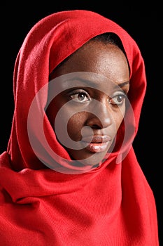 Religious african amercian woman in red headscarf