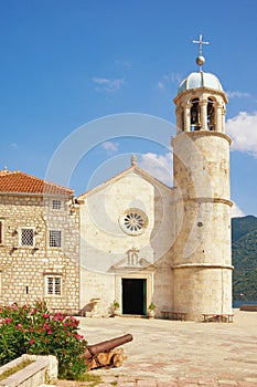 Religious architecture. View of ancient Church of Our Lady of the Rocks on sunny summer day. Montenegro, Bay of Kotor