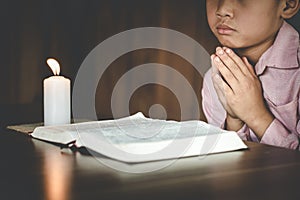 Religious asian buddhist boy praying. boy buddhist disciple meditating,Pay respect, Pray to God