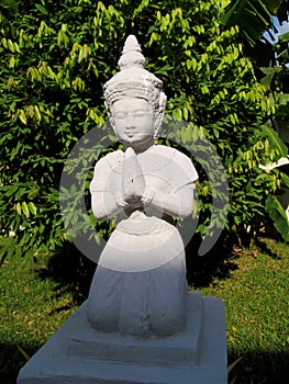 Religious asian statue of praying woman
