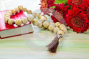 Religious background with book and flowers