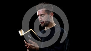 Religious believer holding bible, finding answers to questions, faith in God photo