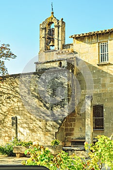 religious building of 1300`s century, with a bell tower and two bronze bells