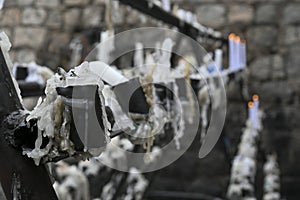 religious candles lit in a Catholic place marking fulfillment of promises