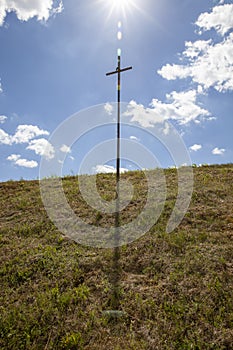 religious catholic metal cross in nature