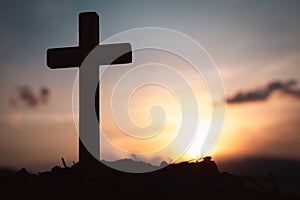 Religious concepts. Christian wooden cross on a background with dramatic lighting,  Jesus Christ cross, Easter, resurrection photo