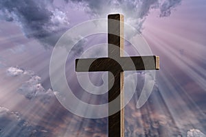 Religious cross against moody sky