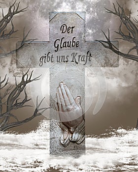 Religious cross with inscription: Der Glaube gibt uns Kraft. In english -Faith gives us strength