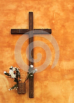 Religious cross on orange wall
