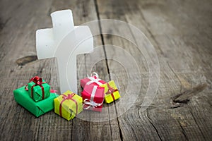 Religious cross with presents