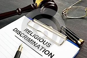 Religious Discrimination claim and pen on a table