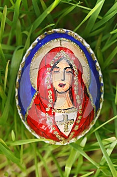 Religious elements painted on an easter egg