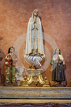 religious figures of saints of the catholic church, our lady of FÃ¡tima, santo Francisco Marto, santa Jacinta Marto