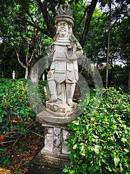 A religious guardian figure near balinese hindu temple on Bali island in Indonesia