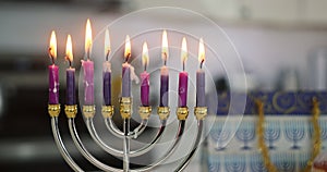 Religious holiday customs in Judaism include lighting hanukkiah menorah candles, which is a central part of Hanukkah