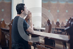 Religious man begging forgiveness in church