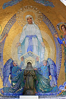 Religious mosaic and statue in Lourdes