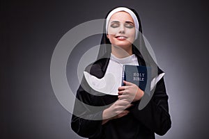 The religious nun in religion concept against dark background