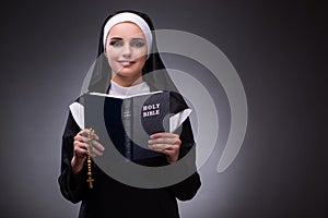 The religious nun in religion concept against dark background