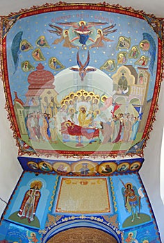 Orthodox church. Religious paintings with Assumption of the Virgin Mary - Bujoreni Monastery, landmark attraction in Romania