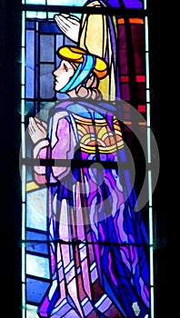 Religious picture on stained glass in the church