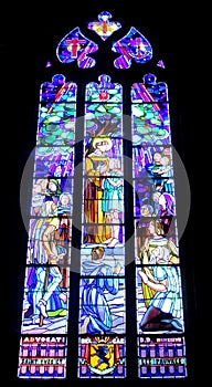 Religious picture on stained glass in the church