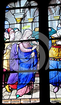 Religious picture on stained glass in the church