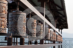 Religious prayer wheel for meditation in a Buddhist temple in Buryatia, Russia Ulan-Ude.