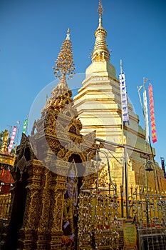 Religious sacred ancient temple travel destination, Golden pagoda at Wat Phra That Cho Hae photo