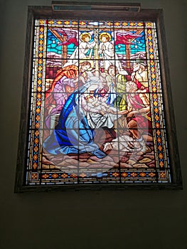 Religious stained glass window of the birth of Jesus