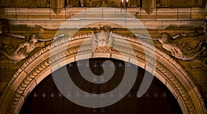 Religious statue above a doorway on a church