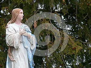 Religious Statue Iconography Mary in an Outdoor Setting photo