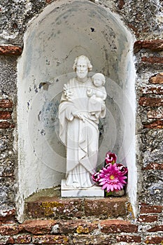 Religious Statue of Joseph with Offerings of Worshipers in Form