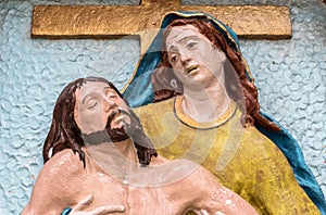 Religious stone statue in color representing The Pity of Michelangelo photo