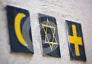 Religious symbols: islamic crescent, jewish David's star, christian cross