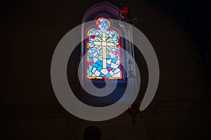 Religious theme cross in leadlight window