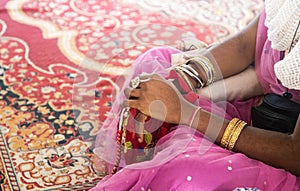 Religious woman chants Maha mantra. japa meditation worship the Holy names of God.