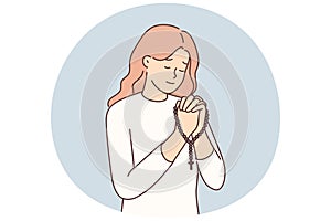 Religious woman pray with rosary