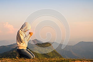 Religious young woman praying to God in the morning, spirtuality and religion, Religious concepts