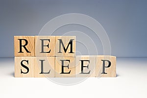 Rem sleep text from wooden cubes. Photo was taken in white background