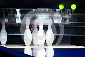 5 remaining bowling pins after the first throw, background night light