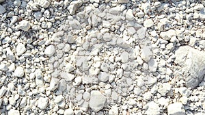 The remaining stretch of water in the dry bed of the Ebo mountain river. brown water and white stones