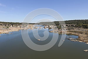 Remains of the Ajuda bridge over The Guadiana River photo